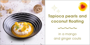 Tapioca pearls and coconut floating in a mango and ginger coulis